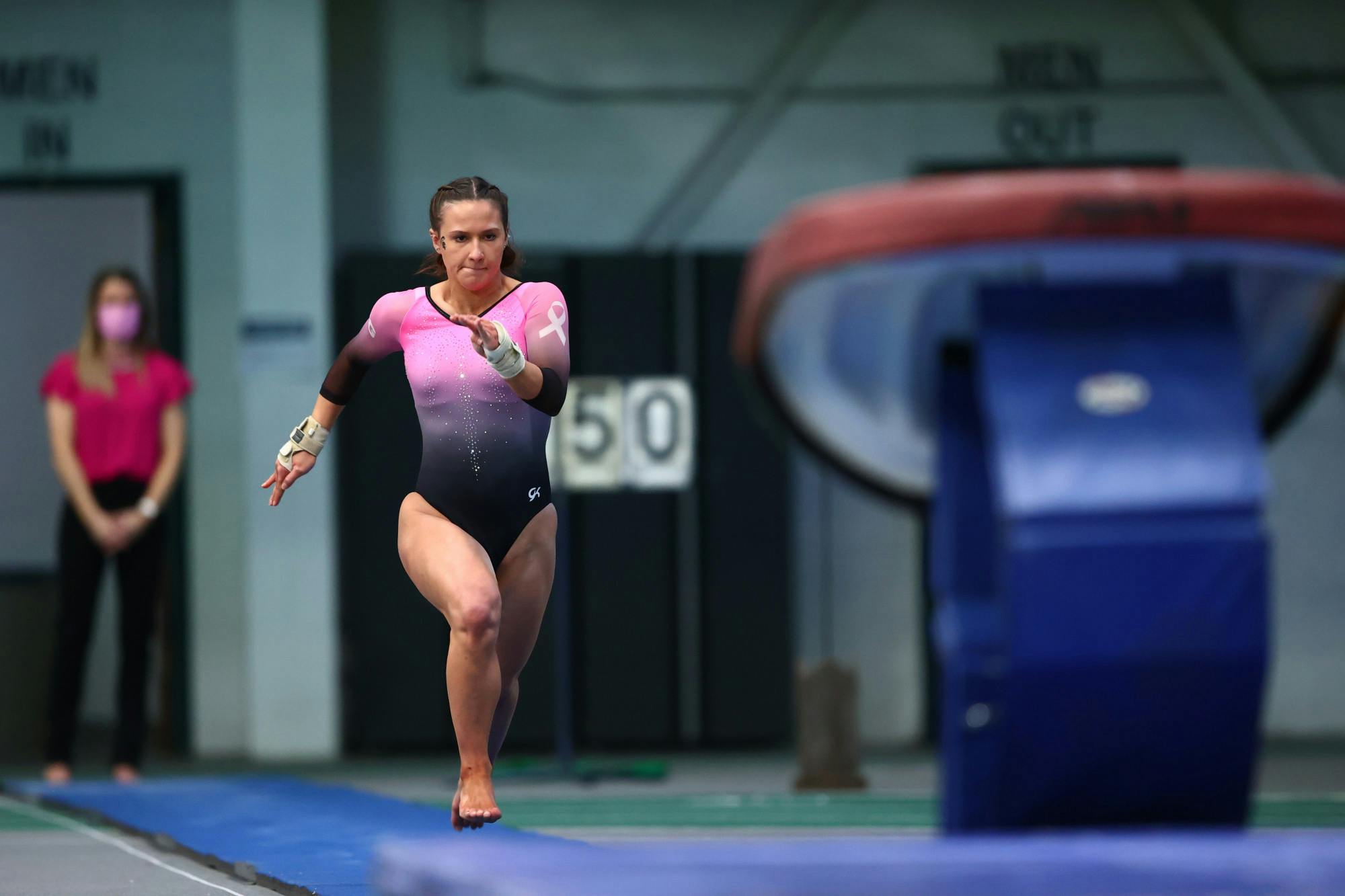 Baleigh Garcia sprints down the mats during an event at Jenison Fieldhouse on MSU's campus during the Spartans gymnastics meet against Nebraska. (Photo by Rey Del Rio / MSU Athletic Communications)