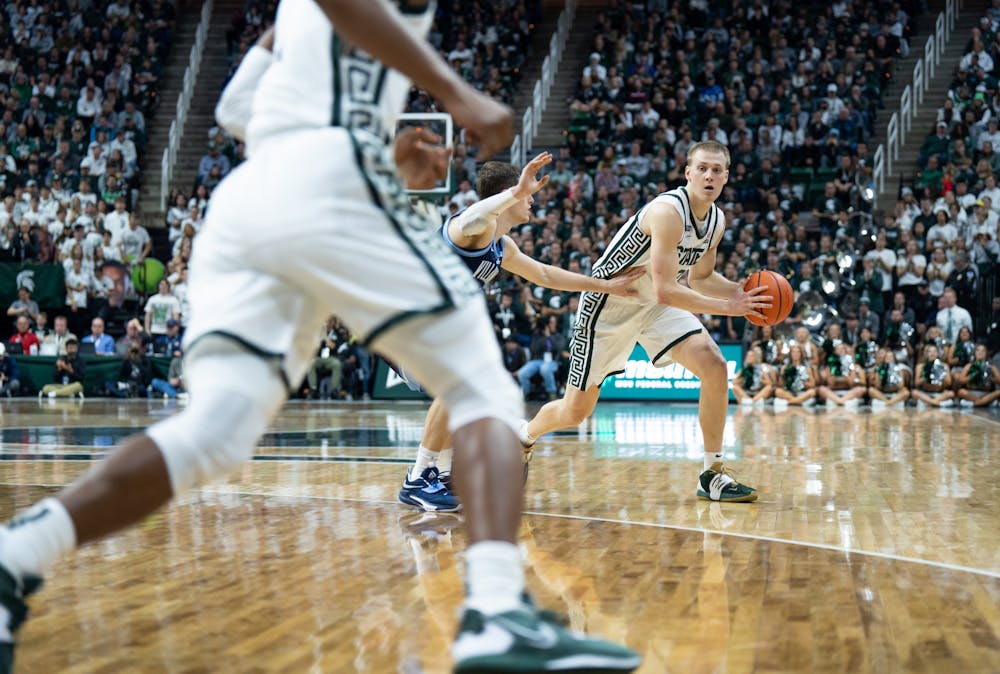 Graduate student forward Joey Hauser (10) is about to pass the ball to his teammate during the game against Villanova at the Breslin Center on Nov. 18, 2022. The Spartans defeated the Wildcats 73-71. 