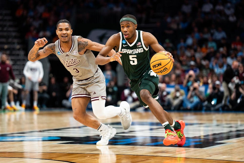 <p>Michigan State sophomore guard No. 5 Tre Holloman drives the basket during round one of March Madness in Charlotte, North Carolina on March 21, 2024. The Spartans dominated the Mississippi State Bulldogs, maintaining a lead throughout the entire game, with a final score of 69-51.</p>