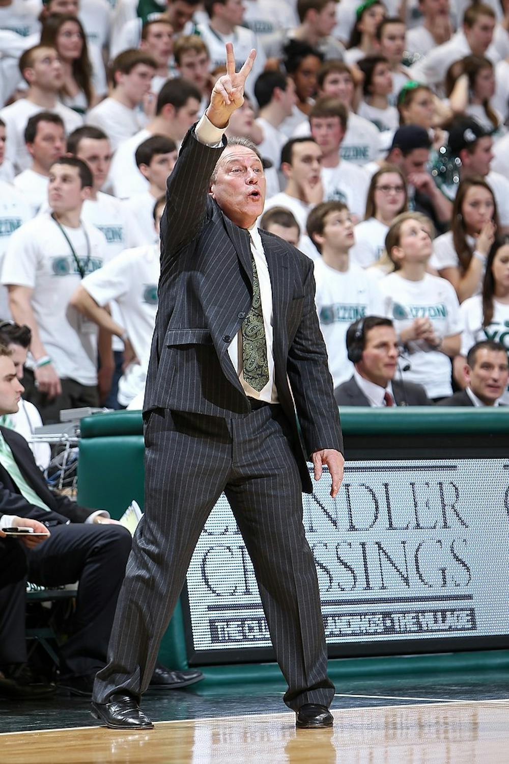 <p>Head Coach Tom Izzo signals to his players February 12, 2013 during a game against Michigan at Breslin Center. The Spartans defeated the Wolverines 75-52.Photo Credit: Matthew Mitchell/ MSU Athletic Communications</p>