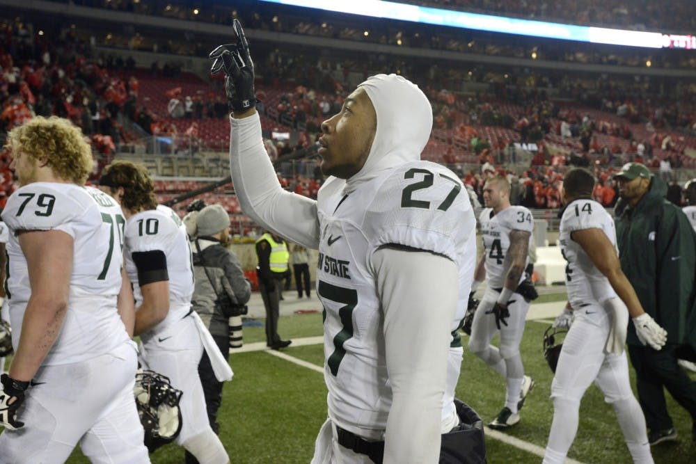 <p>Freshman safety Khari Willis celebrates after the game against Ohio State on Nov. 21, 2015 at Ohio Stadium in Columbus, Ohio. The Spartans defeated the Buckeyes, 17-14.</p>