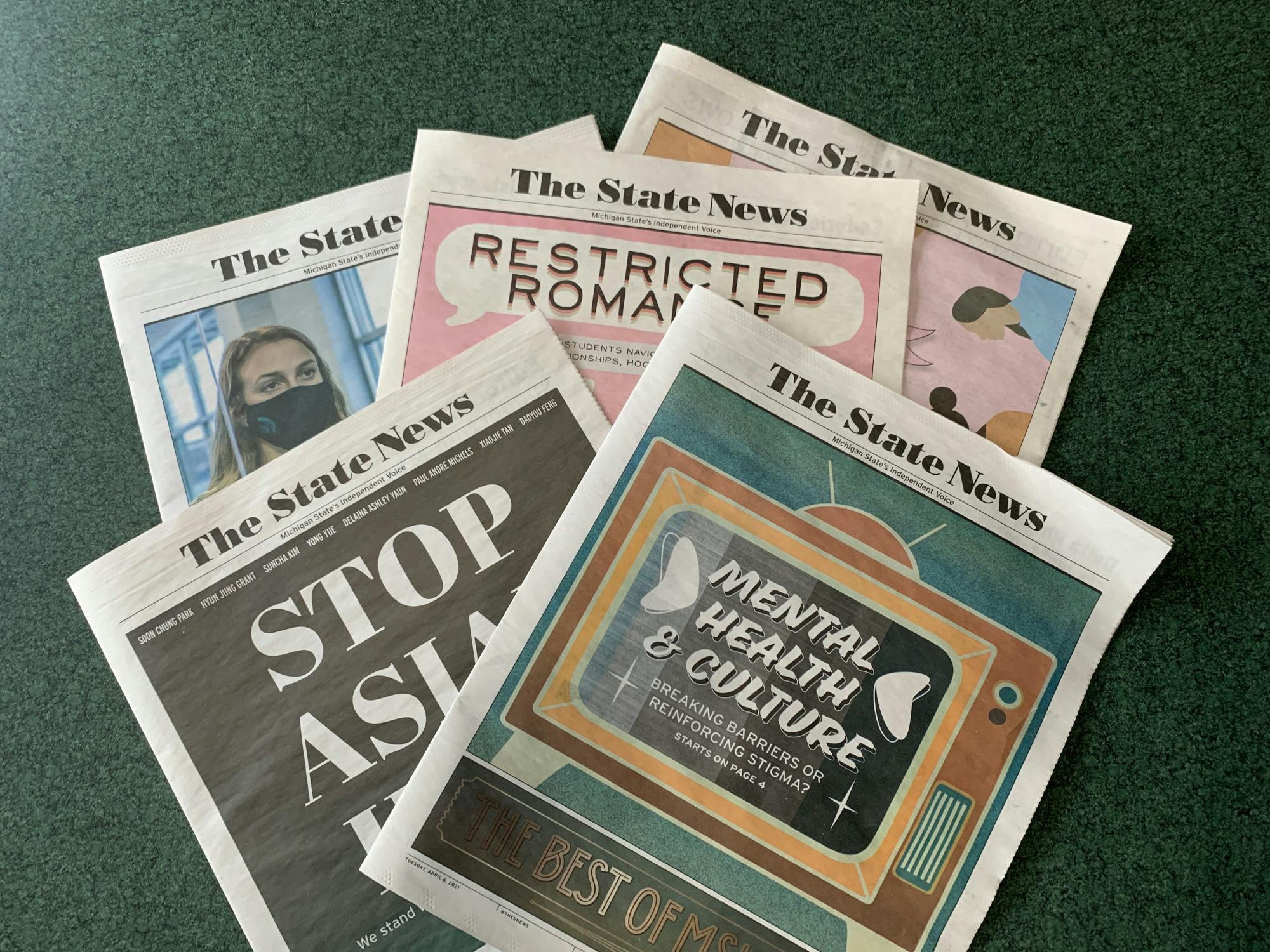 <p>The State News&#x27; spring print issues are pictured on April 19, 2021. Photo by Daena Faustino.</p>