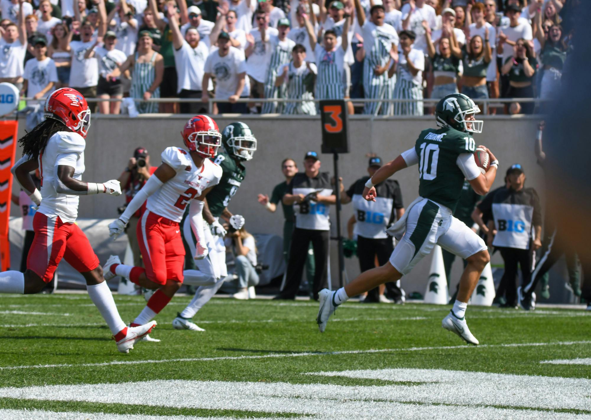 <p>Spartans quarterback Payton Thorne runs the ball into the end zone for the second touchdown for Michigan State, bringing the Spartans to 14-0 against the Penguins. Sept. 11, 2021.</p>