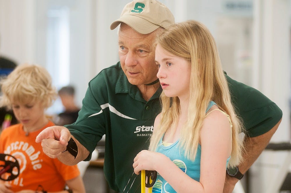 	<p><span class="caps">MSU</span> alumnus John Larzelere talks to his granddaughter, Grand Rapids resident Courtney Lobbes, 12, on June 26, 2013, at <span class="caps">MSU</span> Demmer Shooting Sports, Education and Training Center, 4830 E. Jolly Road, in Lansing. The two were a part of Grandparents University, a three-day educational experience at <span class="caps">MSU</span>. Julia Nagy/The State News</p>