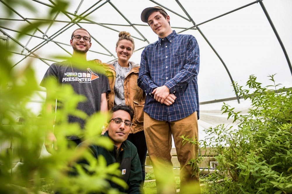 <p>From left to right, chemical engineering senior Abdullah Mohamed, elementary education senior Bethany Kogut, accounting freshman Jake Standerfer, and environmental studies &amp; sustainability senior Alex Marx pose for a picture on Nov. 1 at Bailey Hall. PHOTO: Carly Geraci</p>