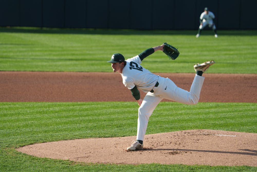 Michigan State freshman pitcher Aidan Arbaugh (12) pitching to Purdue Fort Wayne in the top of the first inning. Michigan State won 7-4 against Purdue Fort Wayne at the McLane Stadium, on Apr. 27, 2022.