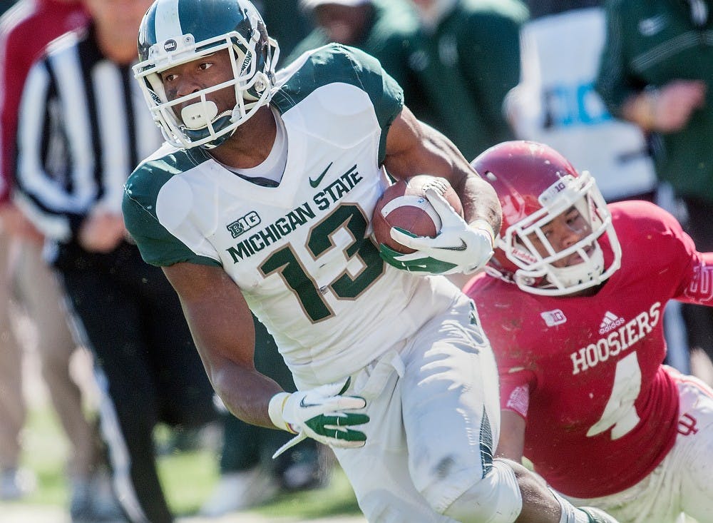 	<p>Junior wide receiver Bennie Fowler catches the ball and runs for a touchdown Oct. 6, 2012 at Memorial Stadium in Bloomington, Ind. Head coach Mark Dantonio said Fowler has been taking starter reps during spring practice. Adam Toolin/The State News</p>