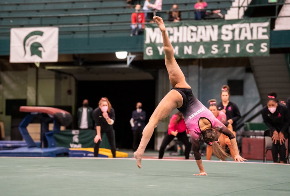 <p>MSU gymnast completes her floor routine in the Spartans&#x27; match against the University of Iowa Hawkeyes at Jenison Field House on Saturday, Jan. 22, 2022. </p>