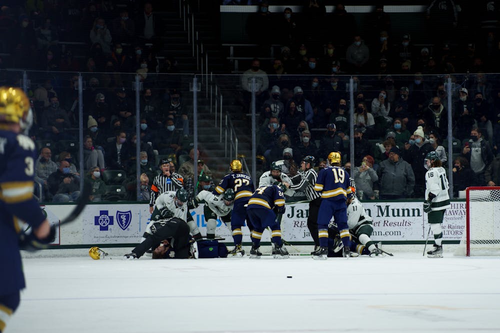 <p>A brawl occurring between Michigan State and Notre Dame hockey players in the third period on Feb. 18, 2022. Spartans lost 2-1 against Notre Dame.</p>