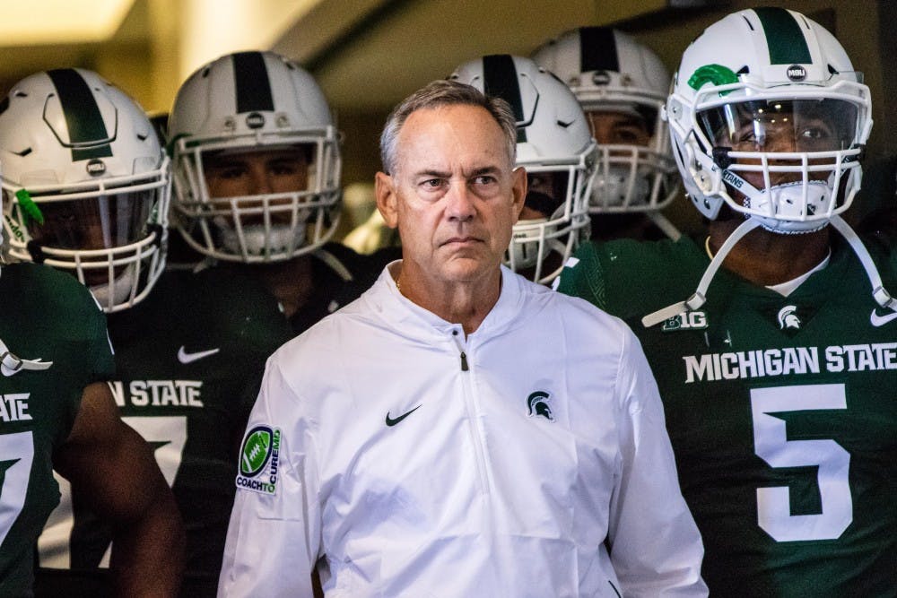 <p>Former Head Coach Mark Dantonio walks out of the tunnel with the team before the game against Central Michigan on Sept. 29, 2018 at Spartan Stadium. The Spartans defeated the Chippewas, 31-20.</p>