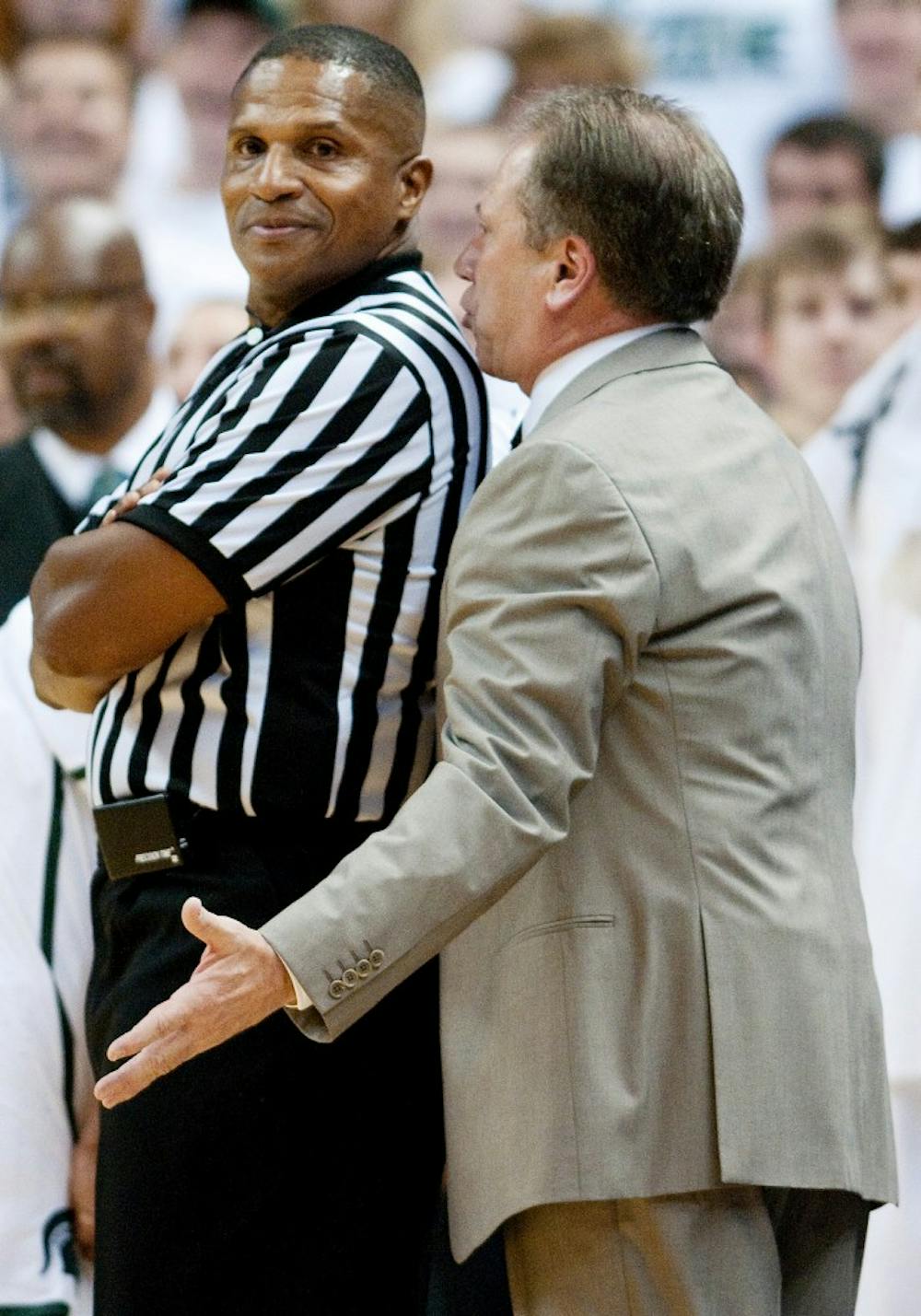 Head coach Tom Izzo talks with Ted Valentine after he made a call Izzo didn't agree with. The Spartans defeated Florida State, 65-49, on Wednesday night at Breslin Center. Josh Radtke/The State News