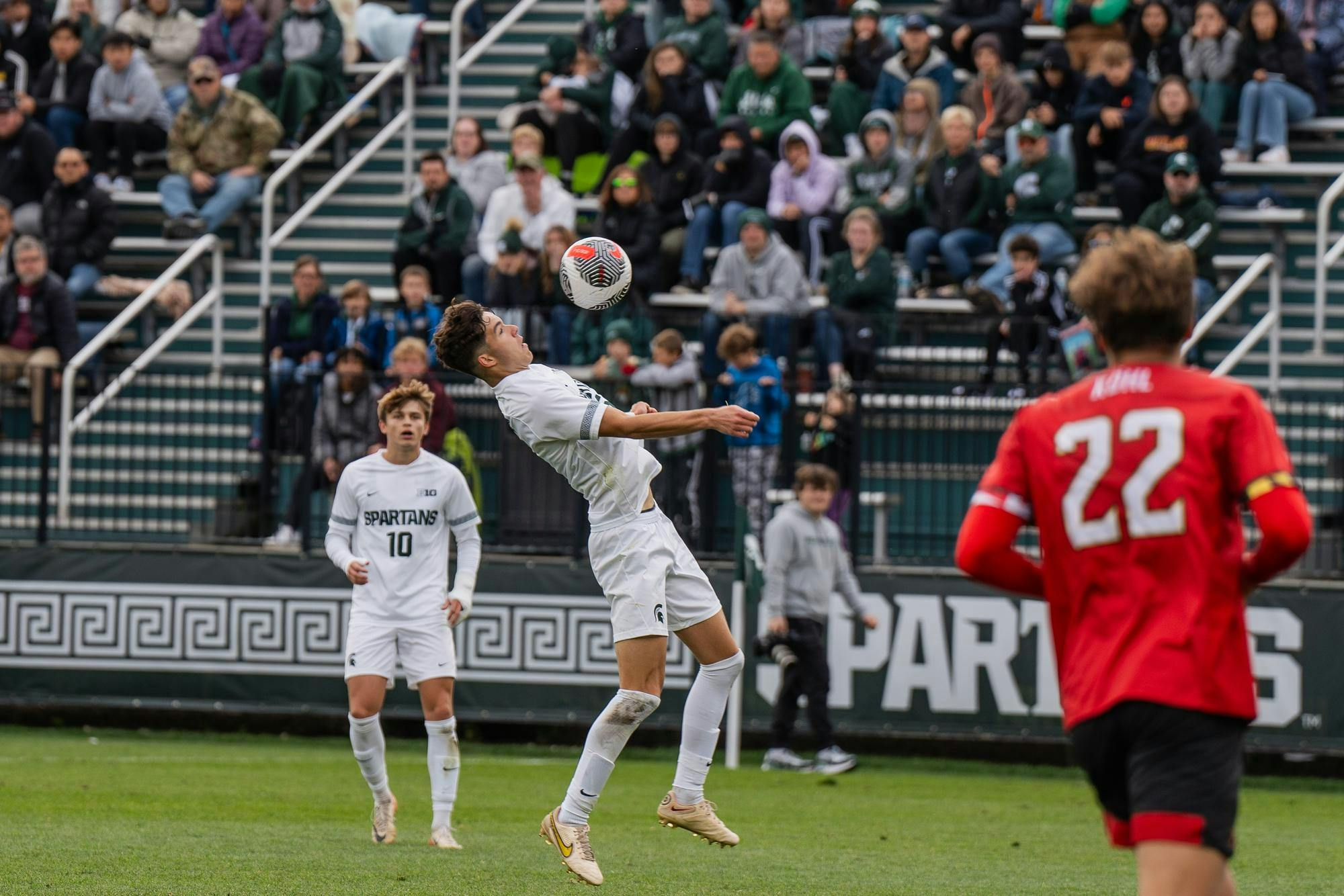 <p>Michigan State University freshman forward Richie Ludwig (10) watches his fellow player catch a ball with his chest at DeMartin Soccer Complex on Oct. 15, 2023.</p>