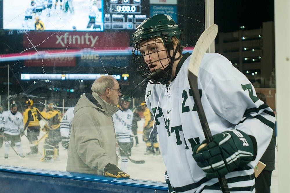 	<p>Junior forward Matt Berry steps off the ice following the game against Michigan, Dec. 28, 2013, at Comerica Park in Detroit. The Spartans won the consolation game of the Great Lakes Invitational, 3-0. Danyelle Morrow/The State News</p>