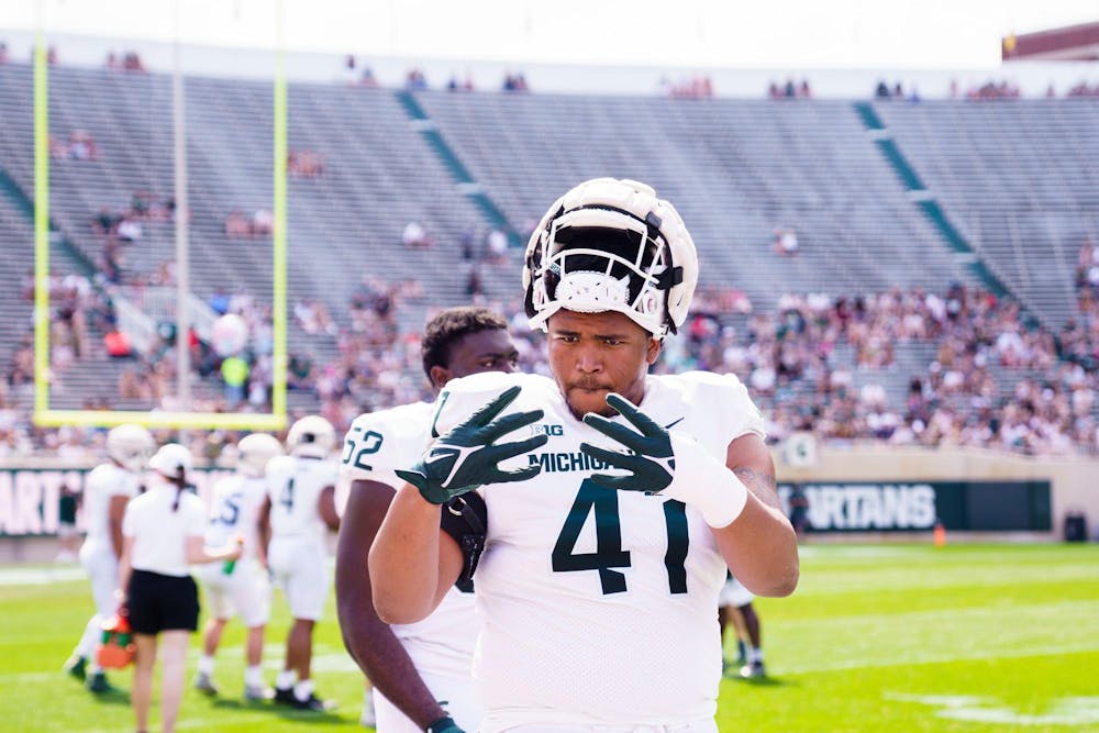  Redshirt sophomore defensive lineman Derrick Harmon (41) poses for the camera during the MSU football spring open practice, held at Spartan Stadium on April 15, 2023.