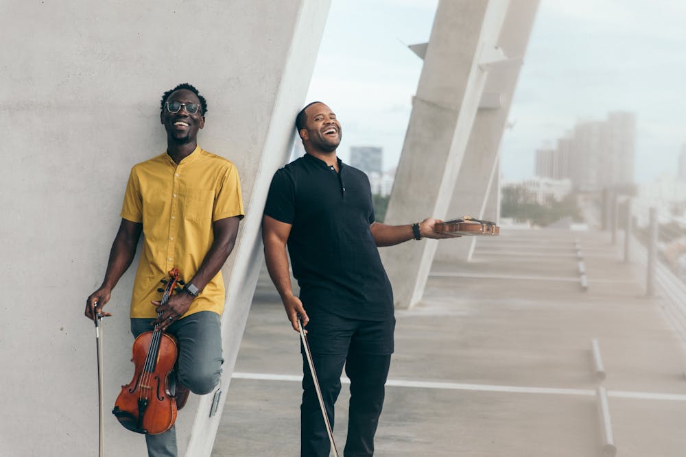 <p>Wil Baptiste and Kev Marcus of the Black Violin Experience, courtesy of Mark Clennon.</p>