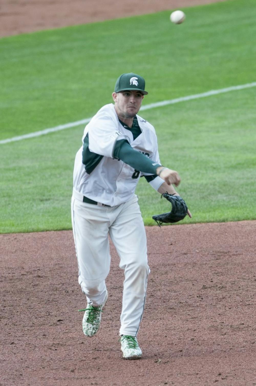 <p>Senior infielder Justin Hovis throws to first base in the third inning during the baseball exhibition game against Air Force on Sept. 19, 2015 at McLane Stadium. MSU baseball season begins in February. Jack Stephan/The State News</p>