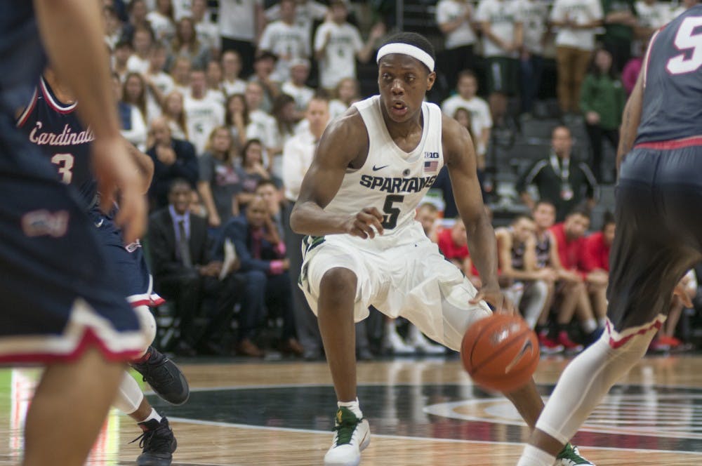 Freshmen guard Cassius Winston (5) dribbles the ball during the game against Saginaw Valley State University on Nov. 2, 2016 at the Breslin Center. The Spartans defeated the Cardinals 87-77.