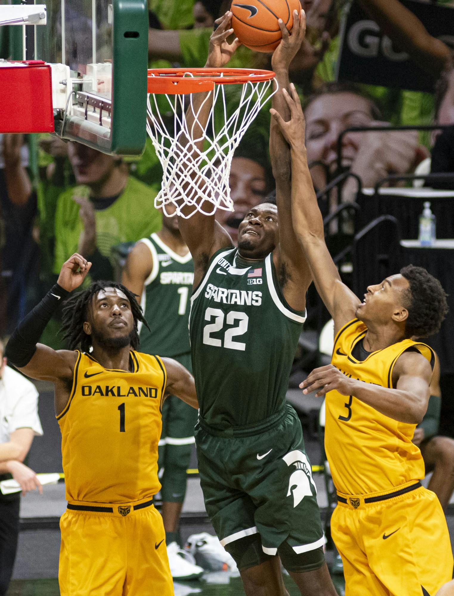 <p>Then-freshman center Mady Sissoko (22) attempts to dunk on the Oakland net during the second half, but is unsuccessful. The Spartans came back after the first half to pull out a 109-91 win on Dec. 13, 2020.</p>