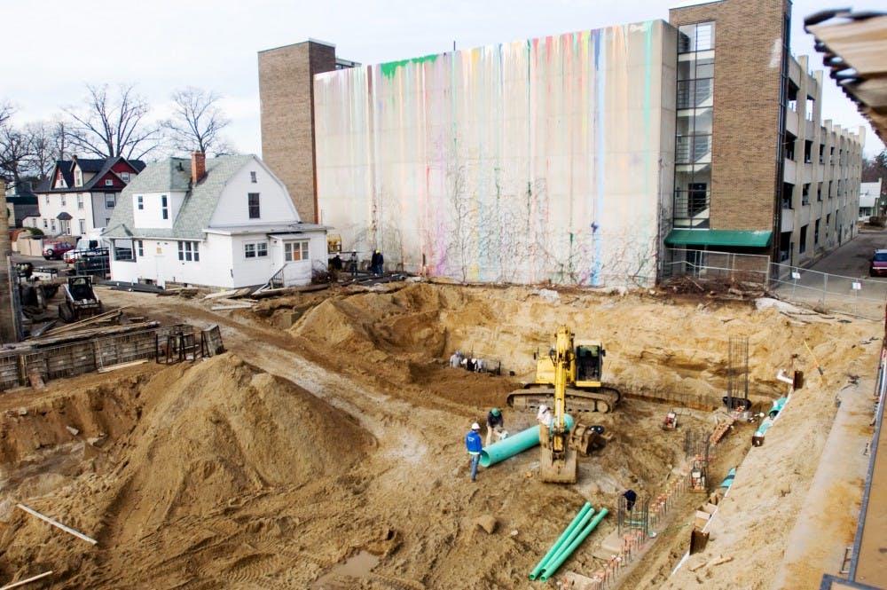 A crew of construction workers from City Construction work diligently Wednesday afternoon at the building site of St. Anne Luxury Lofts. The project is slated to be finished Summer 2012. Samantha Radecki/The State News