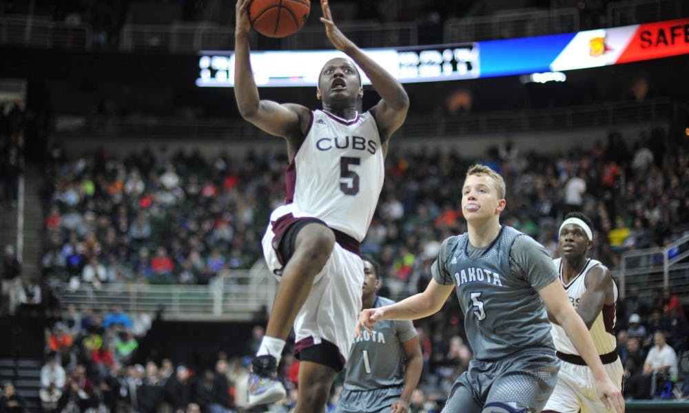 Varsity forward Cassius Winston goes for a lay up during the game semifinal game between Detroit U-D Jesuita and Macomb Dakota on March 25, 2016 at  Breslin Center