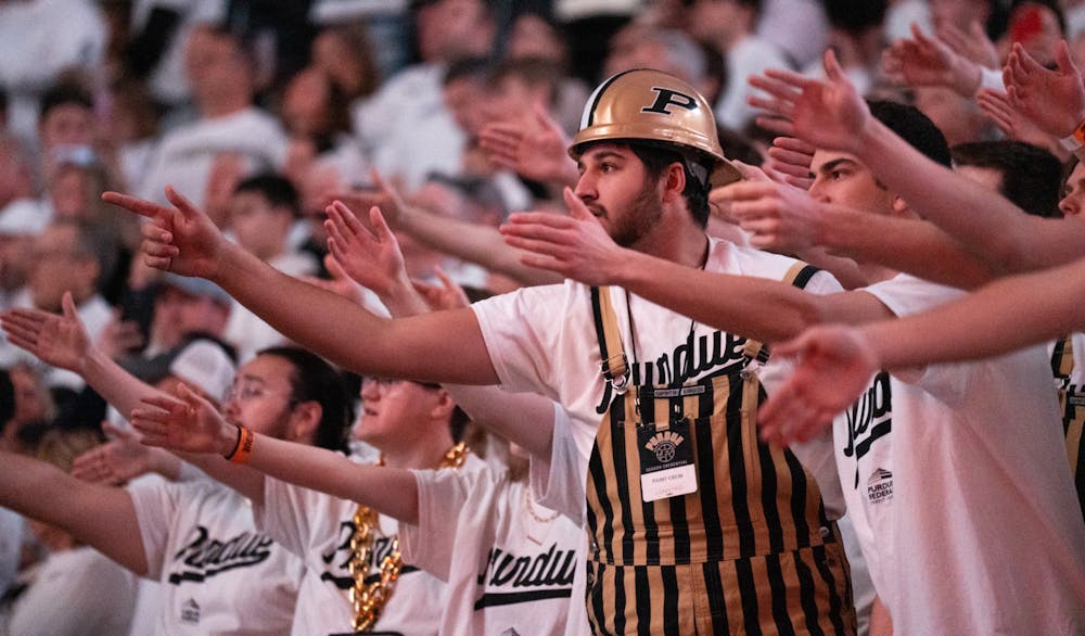 <p>Purdue men's basketball student section, known as "The Paint Crew," cheer on the team during a game against MSU at Mackey Arena on Jan. 29, 2023. The Spartans lost to the Boilermakers 77-61.</p>
