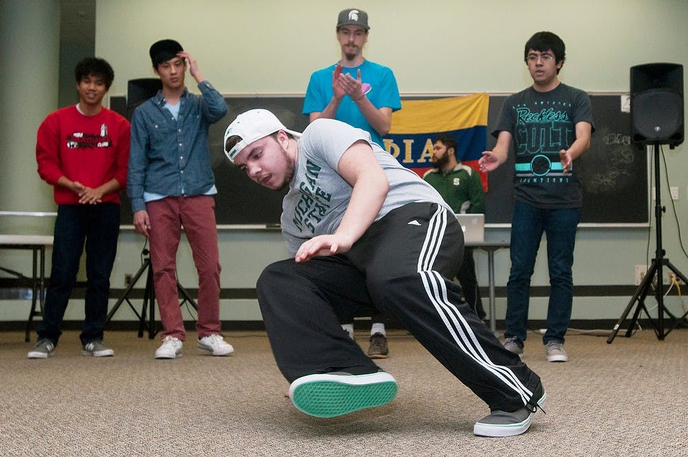 	<p>Political science freshman Nick Luochesi performs with other members of the <span class="caps">MSU</span> Breakdance Club during a celebration of Afro-Latino week Feb. 20, 2014, in the Wonders Hall Kiva. Multiple dance groups performed, along with a spoken word presentation, at the event which was sponsored by Phi Chapter Phiotas. Casey Hull/The State News</p>