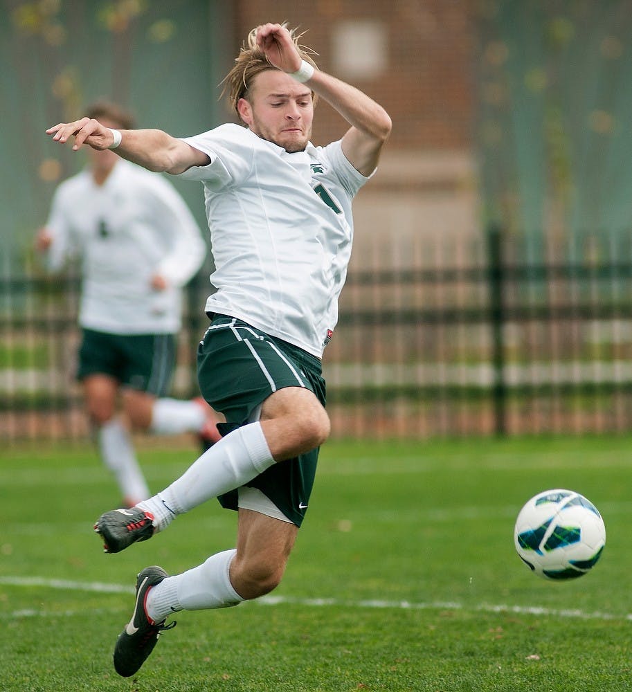 Sophomore defender Ryan Keener kicks the ball to teammates Oct. 28, 2012, at DeMartin Stadium at Old College Field. The Spartans won their game against the Indiana Hoosiers, 3-1. Natalie Kolb/The State News