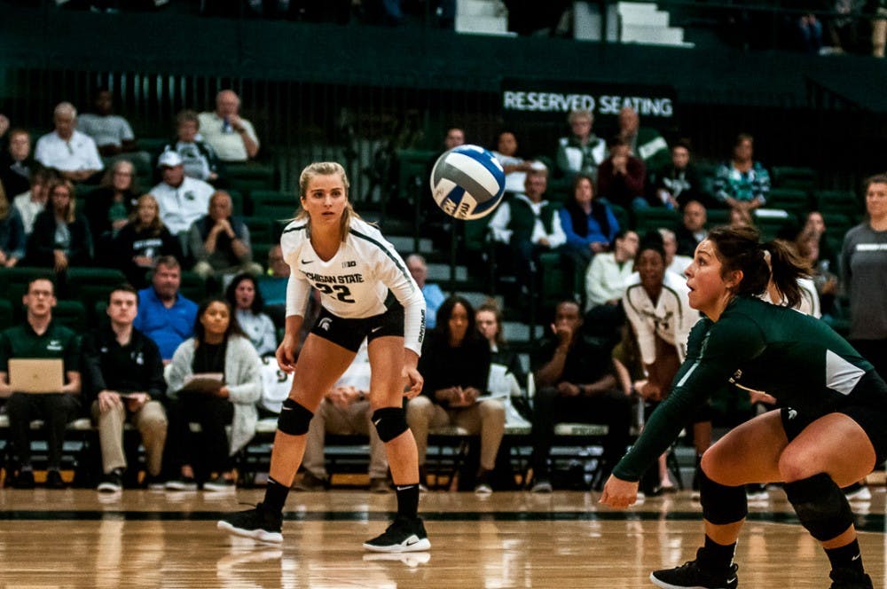 <p>Sophomore libero Jayme Cox (4) goes in for a dig during the game against Rutgers on Sept. 29, 2018 at Jenison Fieldhouse. &nbsp;&nbsp;The Spartans beat the Scarlet Knights, 3-1. &nbsp;</p>
