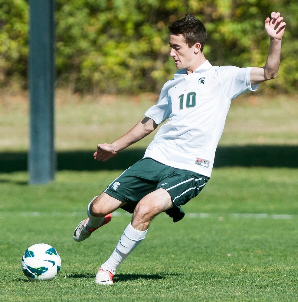 Freshman midfielder Jay Chapman kicks the ball during a game against Wisconsin on Oct. 21, 2012, at DeMartin Stadium at Old College Field. The Spartans, who won 2-0, stand at 7-7-1 and 2-2-0 in conference action. Julia Nagy/The State News