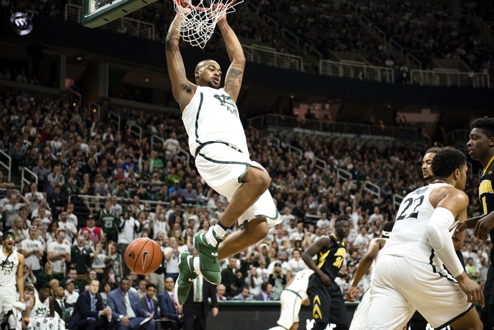 Freshman forward Nick Ward (44) dunks the ball during the second half of men's basketball game against Iowa on Feb. 11, 2017 at Breslin Center. The Spartans defeated the Hawkeyes, 77-66.