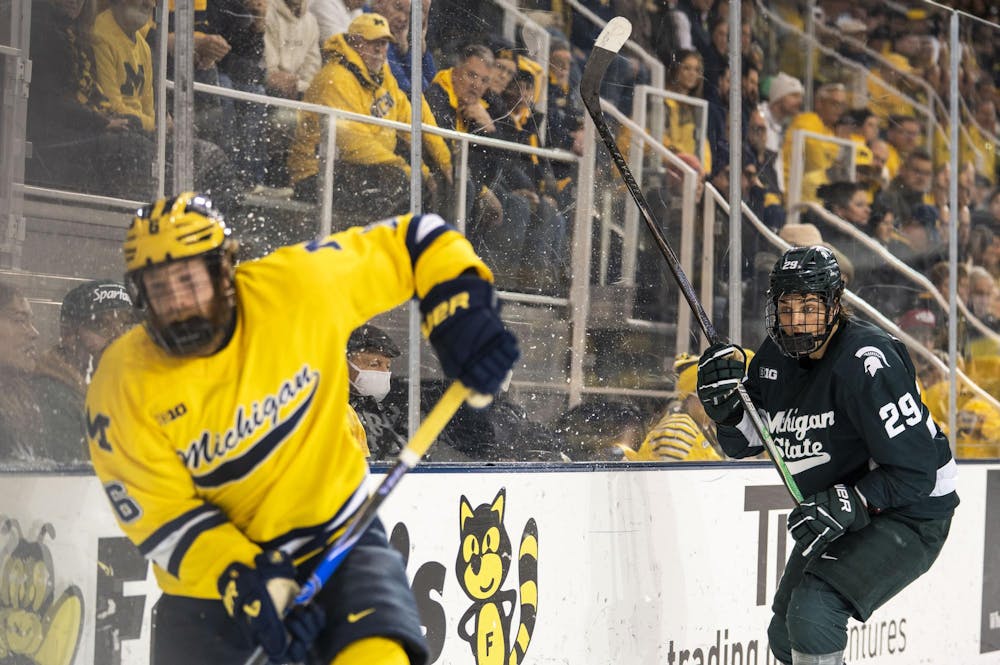 <p>Michigan State junior forward Gavin O'Connell (29) skates after University of Michigan senior forward Josh Eernisse (6) to get the puck at the Yost Ice Arena in Ann Arbor, Mich. on Dec. 6, 2025.</p>