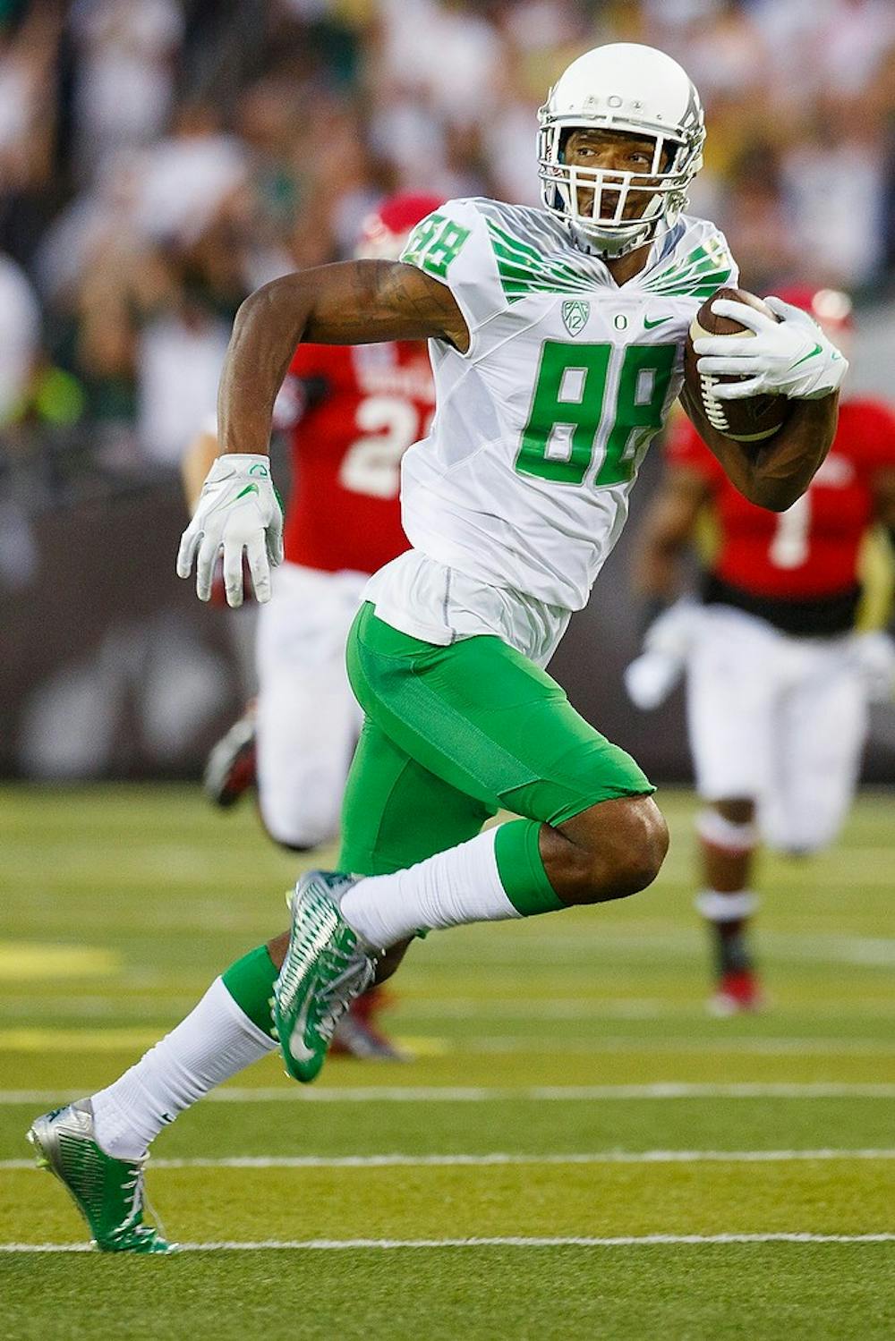 <p>Oregon wide receiver Dwayne Stanford looks back as he sprints into the end zone to score a touchdown during the game against South Dakota Coyotes at Autzen Stadium in Eugene, Oregon on Aug. 30, 2014. Photo courtesy of Taylor Wilder/Emerald</p>