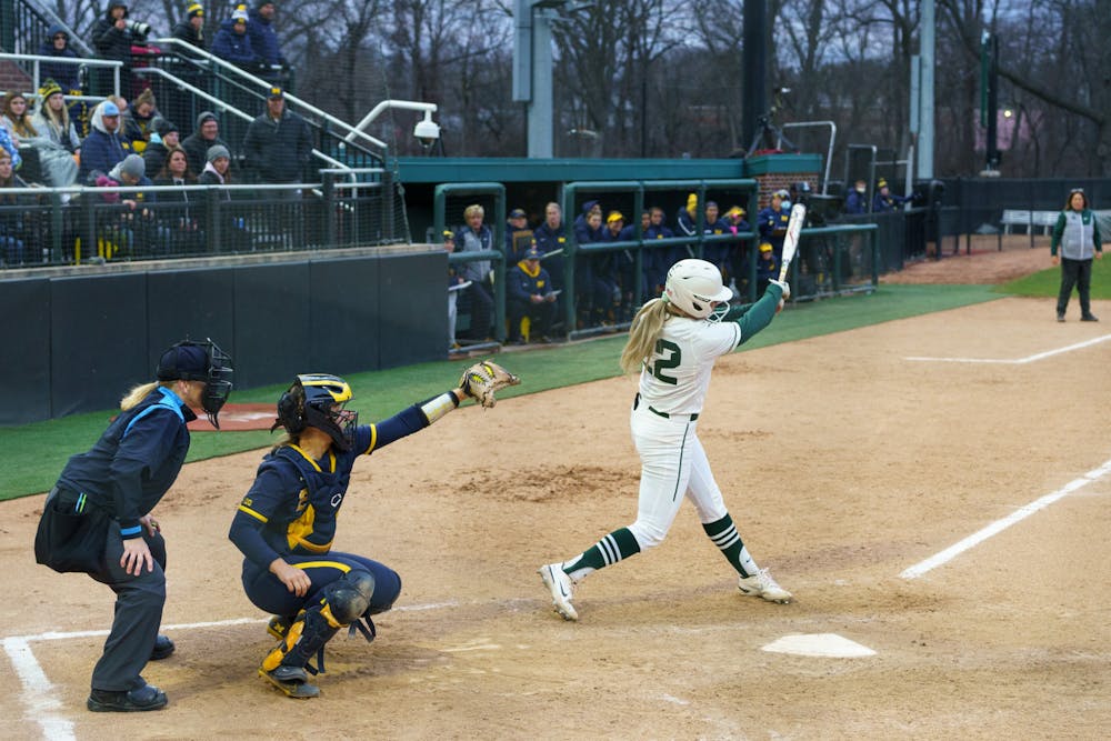 <p>Michigan State senior Mackenzie Meech (22) striking then was caught out after a fly ball to right field in the bottom of the seventh inning. Michigan State lost 3-0 to Michigan at the Secchia Stadium, on April 19, 2022.</p>