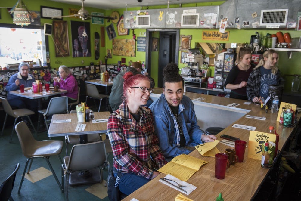<p>Emma Davis, left, and Zac Pobo, both of Lansing, joke around while deciding what to eat at Golden Harvest in Lansing on Monday, March 25, 2019. &quot;The food&#x27;s amazing and the environment&#x27;s fun,&quot; Pobo said. (Nic Antaya/The State News)</p>