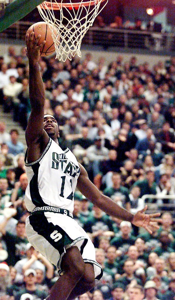 <p>Then-senior guard Mateen Cleaves goes up for a shot against Indiana Tuesday at the Breslin Center. The Spartans won, 77-71 in overtime, giving Tom Izzo his 100th win as MSU head coach.Photo courtesy of MSU Athletics by Cory Morse</p>