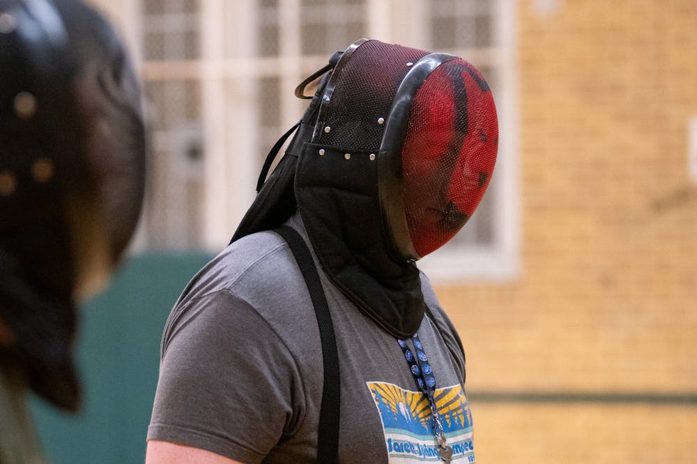 Sophomore Jakob Stibal listening to instructions during a practice session for the MSU Renaissance Sword Society at IM Circle on March 28, 2024.