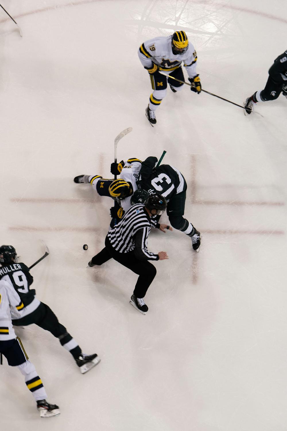 <p>Sophomore center Kristoff Papp (13) faces off against a University of Michigan player. MSU Hockey fell to the University of Michigan, 4-1, in the first game of the Big Ten Men&#x27;s Hockey Tournament at the Yost Ice Arena on March 04, 2022.</p>