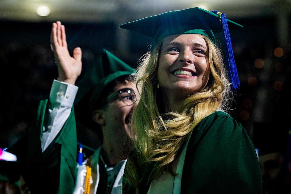 Graduates smile as they turn their tassels during the Michigan State University College of Communication Arts and Sciences graduation ceremony at the Breslin Student Events Center on Michigan State University’s campus in East Lansing, Mich., on Friday, May 1, 2026.