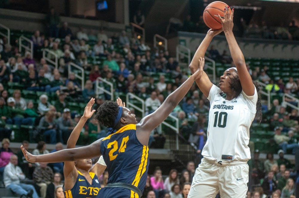 Sophomore forward Syndey Cooks (10) shoots the ball against East Tennessee State’s forward Anajae Stephney (24) during the game against East Tennessee State on Nov. 11, 2018 at Breslin Center. The Spartans lead the Buccaneers at halftime, 32-29.