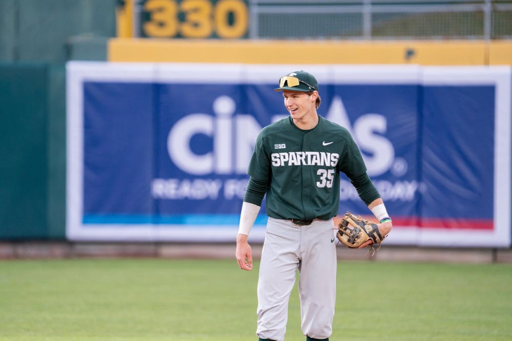 <p>MSU shortstop Randy Seymour laughs with a teammate during a break in the action on during the "Crosstown Showdown" at Jackson Field in Lansing, MI Wednesday, April 3, 2024. The Spartan's fielders were unable to stop the Lugnuts defense and lost 0-18.</p>