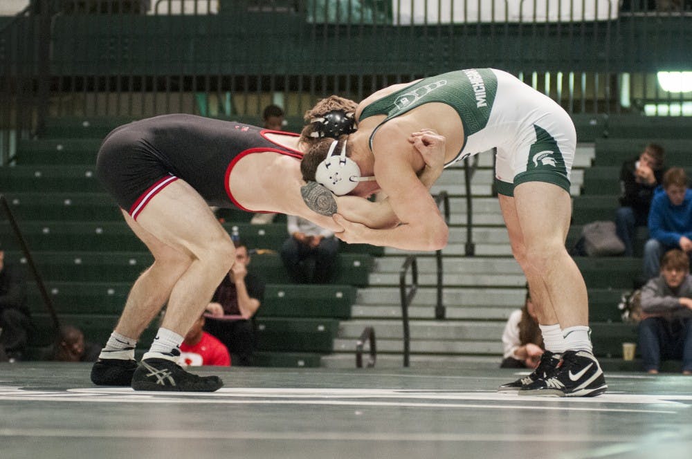 Senior 149-pounder Nick Trimble grapples with Rutgers 149-pounder Ken Theobold on Jan. 29, 2017 at Jenison Field House. The Spartans were defeated by the Scarlet Knights, 12-24.