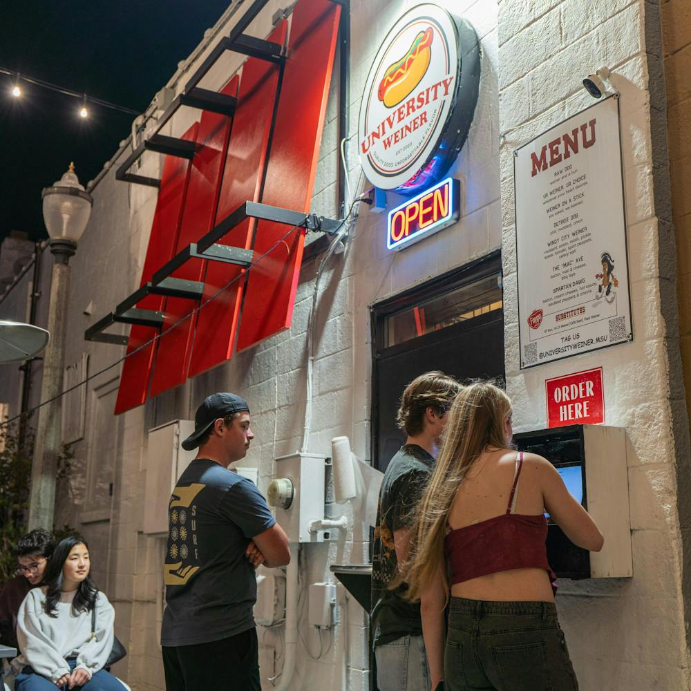 <p>Michigan State University students place their order using a kiosk system on the outside of the building at University Weiner in East Lansing, MI on April 17, 2026.</p>