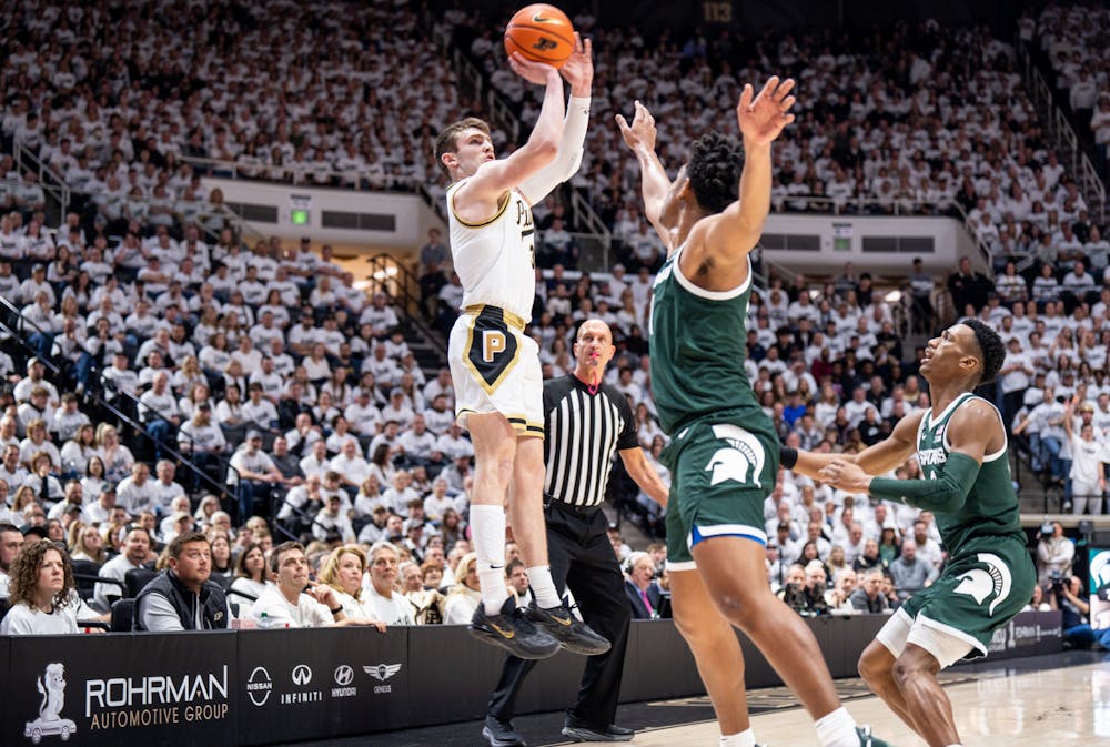 <p>Purdue's freshman guard Braden Smith (3) attempts to make a shot while junior guard A.J. Hoggard (11) and senior guard Tyson Walker (2) guard him during a game against Purdue at Mackey Arena on Jan. 29, 2023. The Spartans lost to the Boilermakers 77-61. </p>
