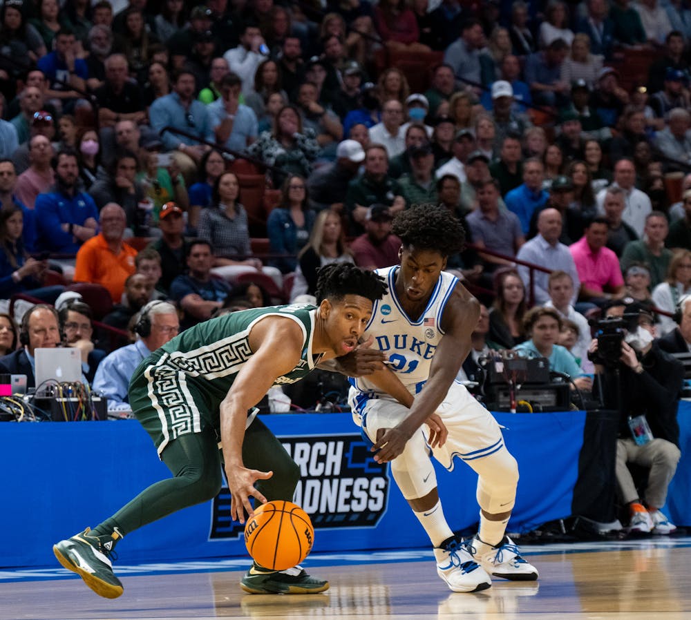 Sophomore A.J. Hoggard (11) defends the ball from freshman AJ Griffin (21) during Duke's victory over Michigan State on March 20, 2022.