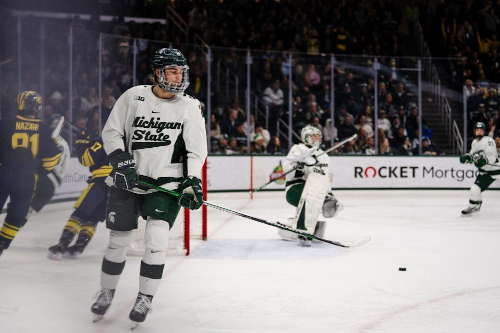 <p>Junior forward Red Savage (21) takes a breath after another goal by Michigan. The Spartans fell to the University of Michigan Wolverines 7-1 on Friday, Jan. 19, 2024.</p>