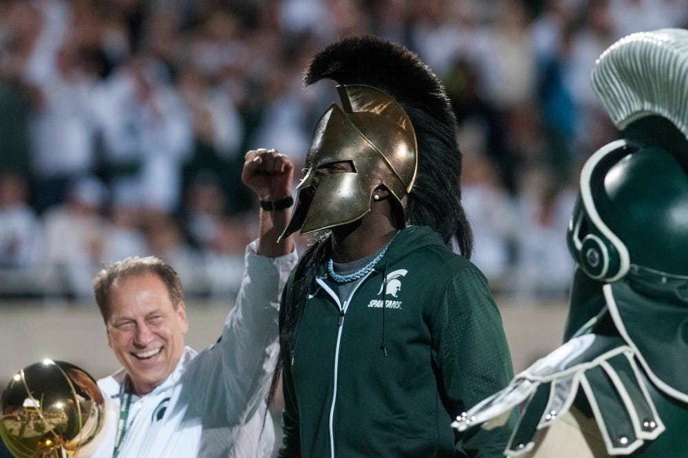 <p>MSU basketball head coach Tom Izzo, former Spartan and current Golden State Warrior forward Draymond Green and Sparty cheer during the game against Oregon on Sept. 12, 2015, at Spartan Stadium. Green was recognized for his recent donation to the Spartan basketball program. The Spartans defeated the Ducks, 31-28. Kennedy Thatch/ The State News</p>