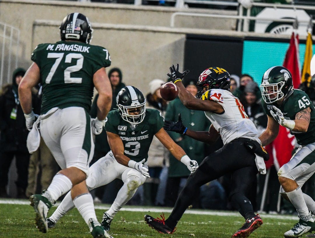 S[partans and Terrapins fight for the ball during the game on Nov. 30, 2019 at Spartan Stadium. The Spartans lead 13-7 against the Terrapins at halftime.