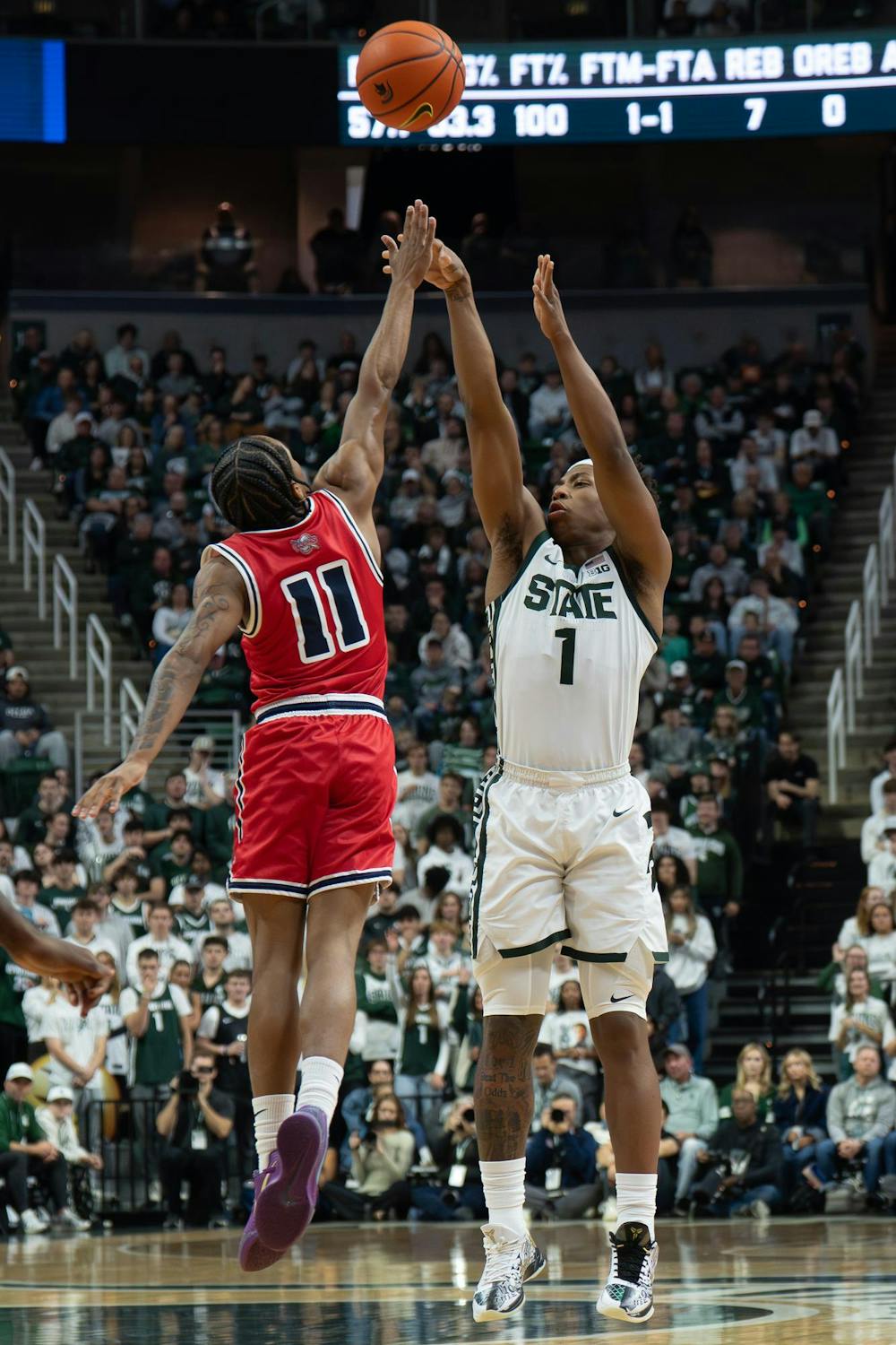 MSU guard Jeremy Fears Jr. (1) shoots the ball as Detroit Mercy guard Lance Stone (11) attempts to block the shot at the Breslin Center in East Lansing, Mich., on Friday, Nov. 21, 2025.
