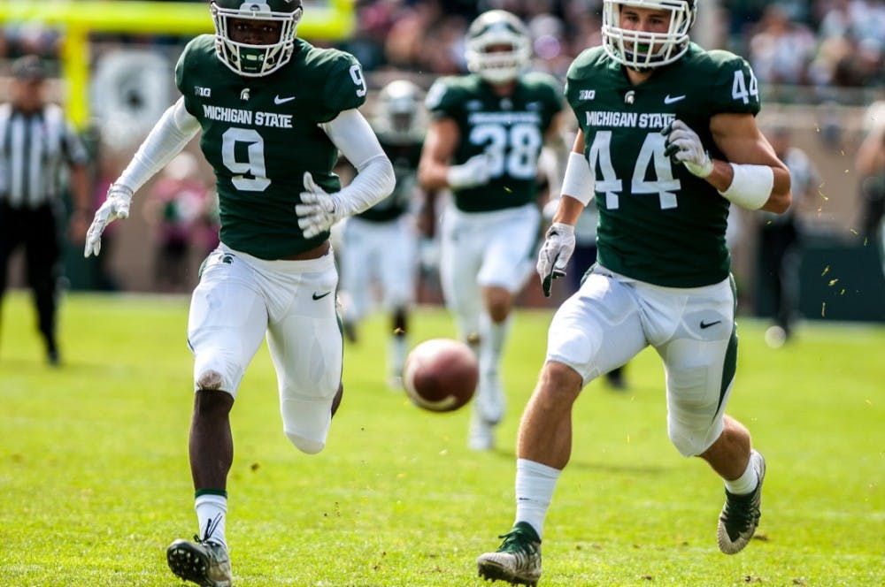 <p>Sophomore safety Dominique Long (9) and senior linebacker Grayson Miller (44) chase after the football during the game against Northwestern Oct. 6, 2018 at Spartan Stadium. The Spartans fell to the Wildcats, 29-19.</p>