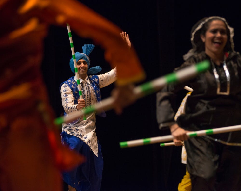 Undecided freshman Harman Sidhu performs with the Bhangra Team during Saathiya on April 9, 2016 at the Wharton Center.  Saathiya is an event put on by the Coalition of Indian Undergraduate Students at MSU. 